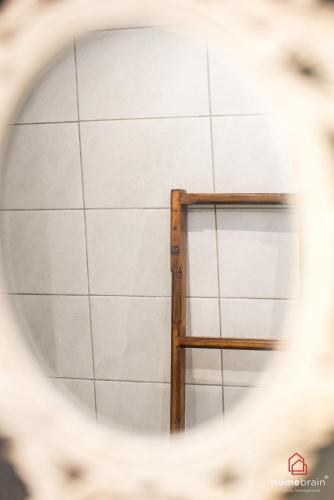 a window in a white tiled wall at Sea Side House in Nea Chili