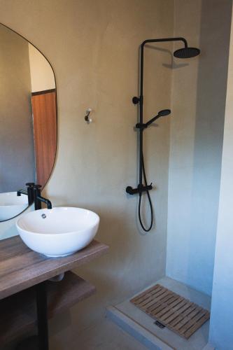 a bathroom with a white sink and a shower at Holiday Home “Vuko” in Trilj