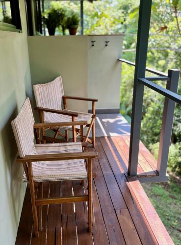 two chairs sitting on the porch of a house at Southern Drake Lodge in Drake