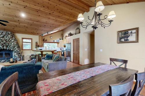 a dining room and living room with a wooden table at Silverado Escape in Tahoe City