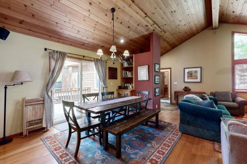 a living room with a wooden table and a couch at Silverado Escape in Tahoe City