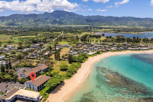 an aerial view of a beach with a resort at Hidden Jewel in Haleiwa
