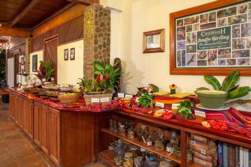 a kitchen with a counter with food on it at Ian Anderson Caves Branch Jungle Lodge in Belmopan