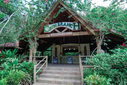 a building with a sign that reads one branch wilderness trail at Ian Anderson Caves Branch Jungle Lodge in Belmopan
