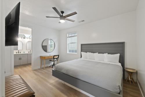 a bedroom with a bed and a ceiling fan at The Millie at Sand Hollow in Hurricane