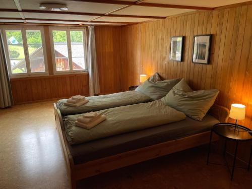 Katil atau katil-katil dalam bilik di Gemütliche Wohnung mit traditionellem Trittofen