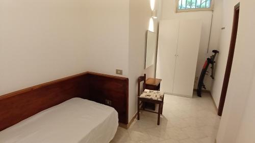 Postel nebo postele na pokoji v ubytování A 2 passi dalla piazza