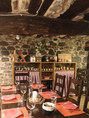 a dining room with a table with wine glasses at Baita Eleonora in Argegno
