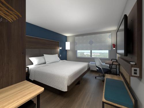 Postel nebo postele na pokoji v ubytování Tru By Hilton Wisconsin Dells