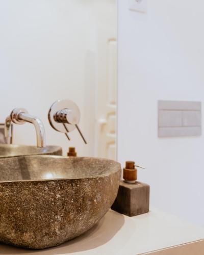 a bathroom with a copper sink on a counter at A Casa Brava in Santarém