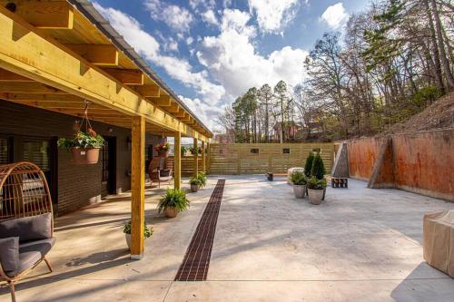 a patio with chairs and plants on a building at Walk to Bathhouses, Historic DTWN Building, Room # 302 in Hot Springs