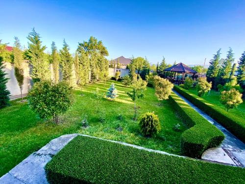 an aerial view of a garden with grass and trees at Villa Lux in Quba in Quba