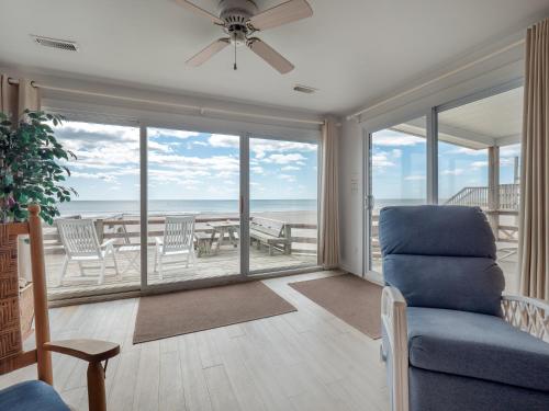 a living room with a view of the ocean at Mamaws Spot in Hampstead
