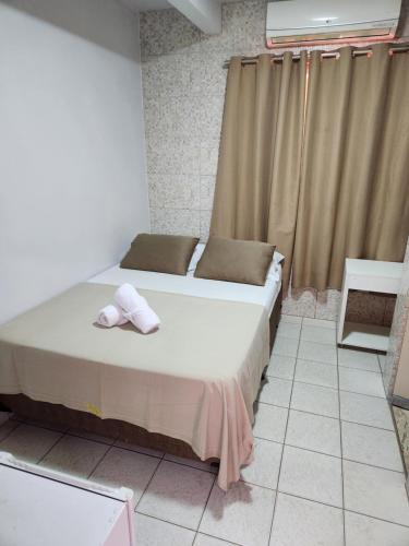 Кровать или кровати в номере Hotel Goiás Norte