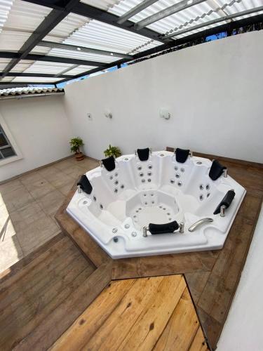a bath tub in the middle of a room at FINCA EL PARAISO in Simijaca