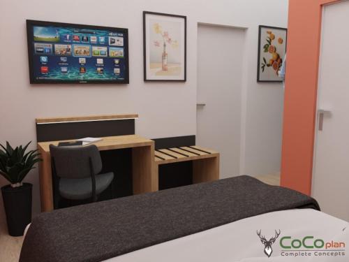 a bedroom with a bed and a desk and a tv at NEU - Sona Design Rooms - CITY CENTER - in Bamberg