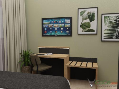 a room with a desk and a tv on the wall at NEU - Sona Design Rooms - CITY CENTER - in Bamberg