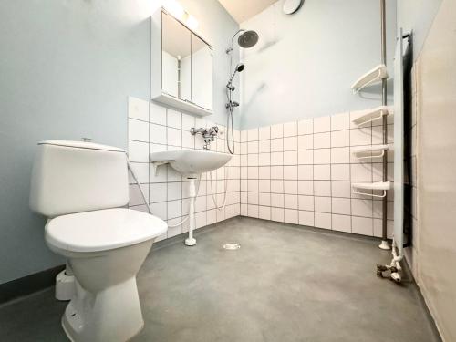a bathroom with a toilet and a sink at Koti Plus - Puhos Kitee in Puhos