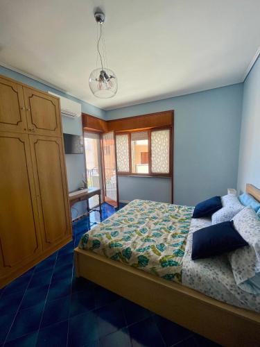 a bedroom with a bed and a dresser in it at CapoTen in Sorrento