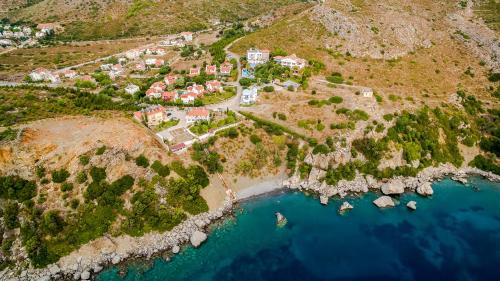 an aerial view of a village on a hill next to the water at Datca Villa Asina in Datca