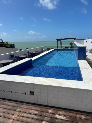 Hồ bơi trong/gần Apartamento Beira Mar