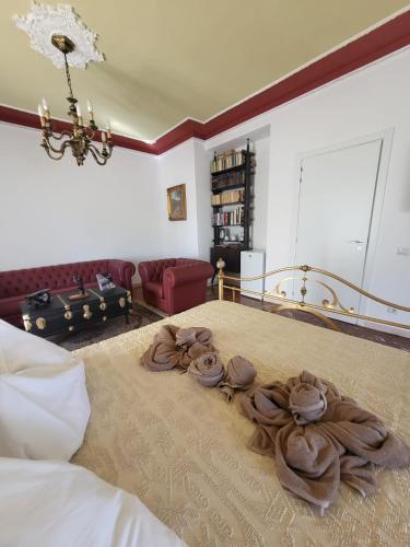 a bedroom with a bed with roses on it at La camera dell’aviatore in Alghero