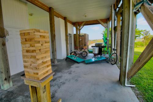 a garage with a bike and a pile of logs at Palm Beach North in North Topsail Beach