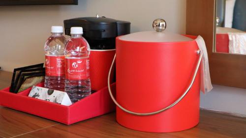 two bottles of cocacola water in a red cooler at The Alder in Monticello