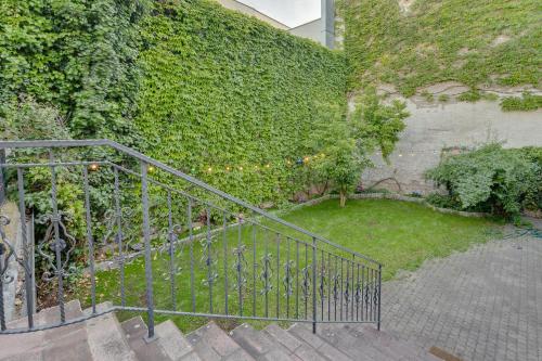 a staircase leading up to a building with a garden at Atik Hotel Vienna in Vienna