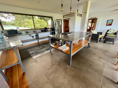 a kitchen and living room with a large window at Southern Drake Lodge in Drake