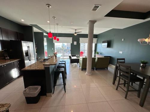 a kitchen and living room with tables and chairs at Bali Bay Resort in Myrtle Beach