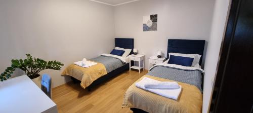 Кровать или кровати в номере Leśna 10