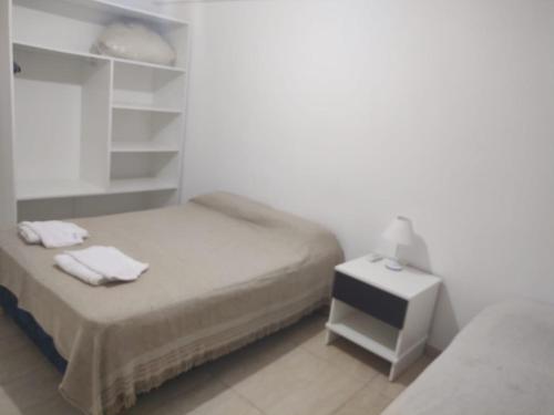 Katil atau katil-katil dalam bilik di Belén Apart Hotel