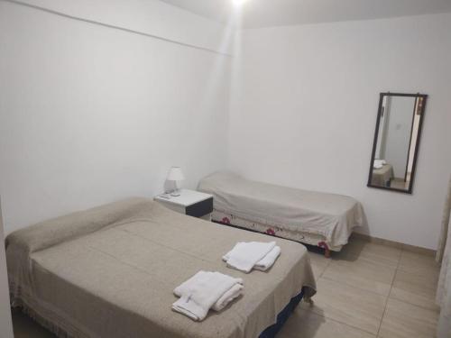 Katil atau katil-katil dalam bilik di Belén Apart Hotel