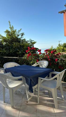 a table and chairs with a blue table cloth on it at Paradise Villa Trabzon in Trabzon