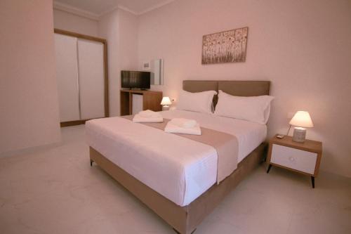 Postel nebo postele na pokoji v ubytování Gusto di Casa Rooms