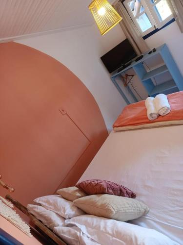 Ένα ή περισσότερα κρεβάτια σε δωμάτιο στο É Hostel