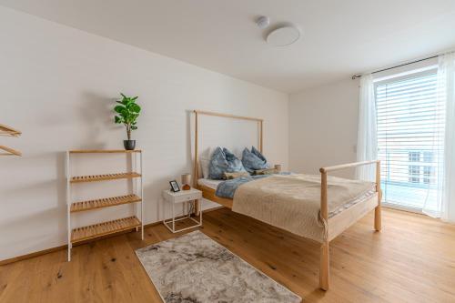 Ένα ή περισσότερα κρεβάτια σε δωμάτιο στο Krems Deluxe Apartments - Newly built