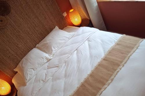 Postel nebo postele na pokoji v ubytování Le Physalis gîte tout confort