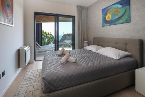 Ένα ή περισσότερα κρεβάτια σε δωμάτιο στο Luxury twin apartments Opatija