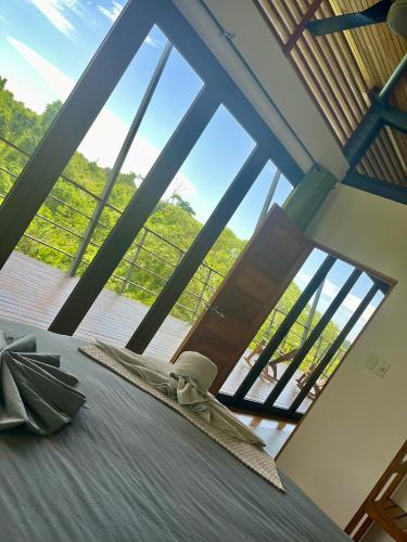 a bedroom with a bed and a large window at Southern Drake Lodge in Drake