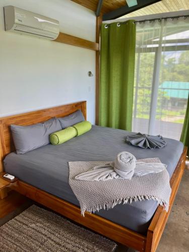 a bedroom with a large bed with a window at Southern Drake Lodge in Drake