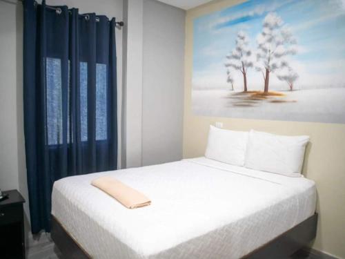 Ένα ή περισσότερα κρεβάτια σε δωμάτιο στο Mi Tierra Aeropuerto SAL Hotel y Restaurante