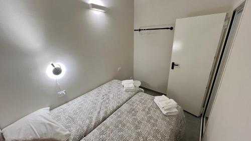 Postel nebo postele na pokoji v ubytování College Suites