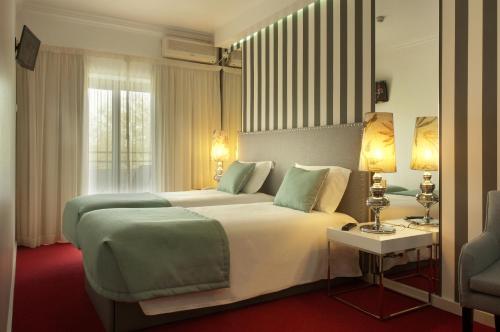 
Uma cama ou camas num quarto em Hotel Lagoa dos Pastorinhos
