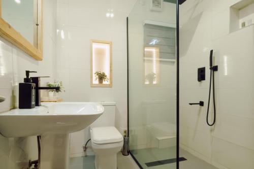 a bathroom with a sink and a toilet and a shower at 3 bedroom Greys Apartment Lifecamp Abuja in Tungan Daudu