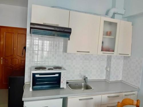 Kuchyň nebo kuchyňský kout v ubytování Scenario Studios