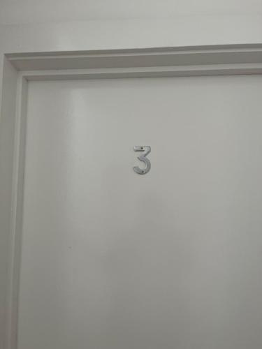 a door with the number on it at Stylish and Spacious Wi-Fi Smart TV Tea and coffee in Kettering