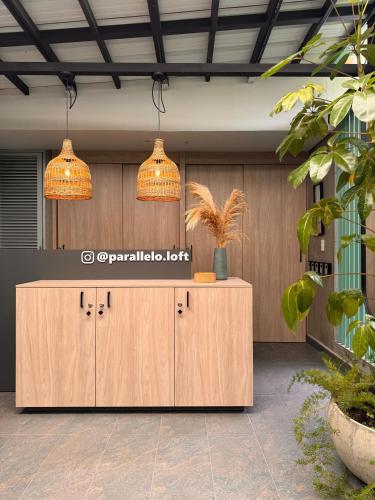 a reception desk in a lobby with two lights at Parallelo Loft Salento P4 in Salento