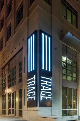 a building with a sign on the front of it at Global Luxury Suites Midtown Atlanta in Atlanta